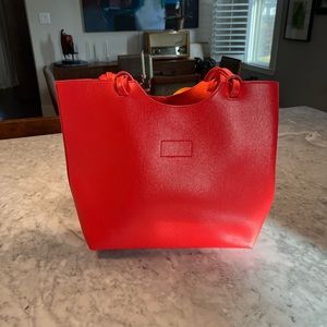 Orange bag from Neiman Marcus.